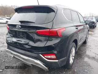 2019 Hyundai Santa Fe SE with VIN 5NMS23AD8KH008680, listed as a IAAI auction lot 42023218 with 67,745 mi miles and . Bid and sale history available at DreamBid. Image 6.