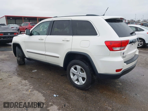2012 Jeep Grand Cherokee Laredo with VIN 1C4RJFAG6CC297958, listed as a IAAI auction lot 40859811 with 213,499 mi miles. Bid and sale history available at carsss.com. Image 3.