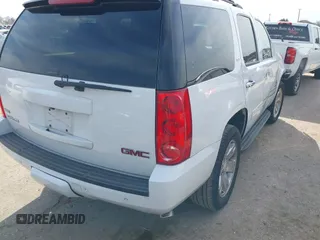 2011 GMC Yukon SLT with VIN 1GKS1CE03BR347941, listed as a IAAI auction lot 41637343 with 198,830 mi miles. Bid and sale history available at carsss.com. Image 4.