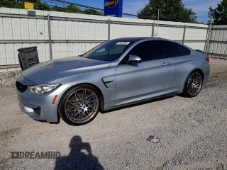 2015 BMW M4 with VIN WBS3R9C58FK334216, listed as a Copart auction lot 61497804 with 112,191 mi miles and Salvage Title. Bid and sale history available at carsss.com. Image 1.