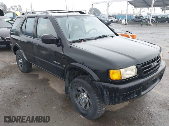 1998 Isuzu Rodeo S z VIN 4S2CM58W6W4336183, wystawiony jako IAAI lot #41874570 z przebiegiem 162 097 mil mil oraz . Historia ofert i sprzedaży dostępna na DreamBid. Obrazek 1.