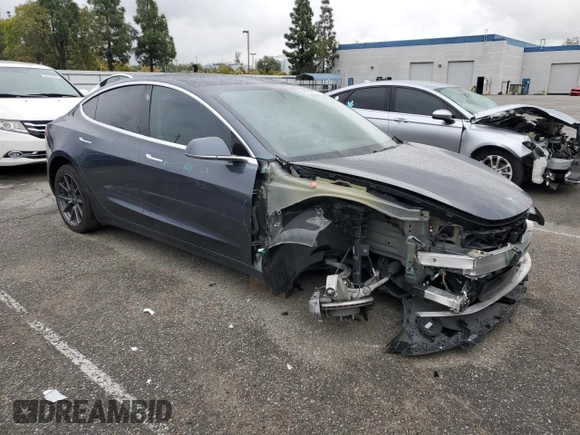2019 Tesla Model 3 Mid Range with VIN 5YJ3E1EA9KF447453, listed as a Copart auction lot 48967605 with 72,031 mi miles and Salvage Title. Bid and sale history available at DreamBid. Image 4.