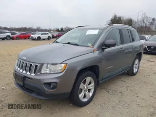 2011 Jeep Compass with VIN 1J4NT1FA2BD241485, listed as a IAAI auction lot 41496076 with 134,825 mi miles. Bid and sale history available at carsss.com. Image 2.