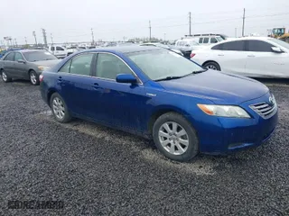 2007 Toyota Camry Hybrid with VIN JTNBB46K473031629, listed as a IAAI auction lot 41950354 with 243,317 mi miles. Bid and sale history available at carsss.com. Image 1.