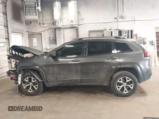 2016 Jeep Cherokee Trailhawk with VIN 1C4PJMBS2GW309042, listed as a IAAI auction lot 41564925 with 125,436 mi miles. Bid and sale history available at carsss.com. Image 15.
