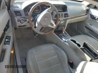 2012 Mercedes-Benz E 550 with VIN WDDKJ7DB2CF151973, listed as a Copart auction lot 82667474 with 130,590 mi miles and Salvage Title. Bid and sale history available at DreamBid. Image 8.