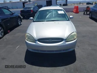 2003 Ford Taurus SE Standard with VIN 1FAFP53UX3G268265, listed as a IAAI auction lot 42090151 with 139,734 mi miles. Bid and sale history available at carsss.com. Image 6.