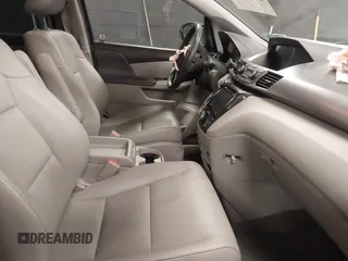 2014 Honda Odyssey Touring with VIN 5FNRL5H94EB105745, listed as a IAAI auction lot 41744012 with 77,032 mi miles and . Bid and sale history available at DreamBid. Image 5.