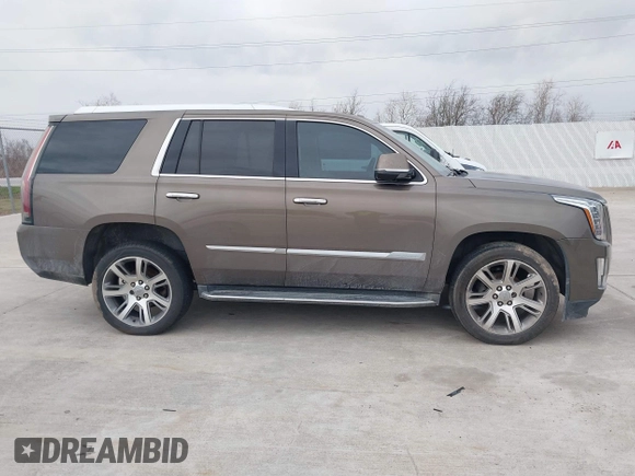 2015 Cadillac Escalade Luxury z VIN 1GYS3MKJ9FR725818, wystawiony jako IAAI lot #41596731 z przebiegiem 224 246 mil mil oraz . Historia ofert i sprzedaży dostępna na DreamBid. Obrazek 13.