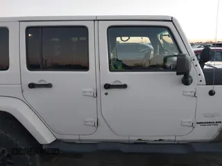 2010 Jeep Wrangler Unlimited Sahara with VIN 1J4BA5H15AL184376, listed as a IAAI auction lot 41270637 with 143,339 mi miles. Bid and sale history available at carsss.com. Image 13.