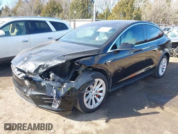 2018 Tesla Model X 75D with VIN 5YJXCDE44JF091690, listed as a IAAI auction lot 41585617 with 128,826 mi miles and . Bid and sale history available at DreamBid. Image 2.
