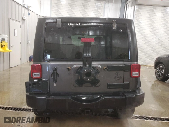 2017 Jeep Wrangler Willys Wheeler with VIN 1C4AJWAG9HL696710, listed as a Copart auction lot 88744905 with 66,800 mi miles and Salvage Title. Bid and sale history available at DreamBid. Image 6.