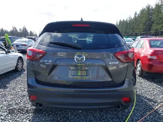 2016 Mazda CX-5 Grand Touring with VIN JM3KE4DY9G0895006, listed as a IAAI auction lot 41703146 with 39,359 mi miles. Bid and sale history available at carsss.com. Image 16.