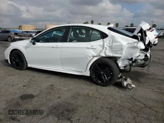 2025 Toyota Camry LE z VIN 4T1DAACK9SU539063, wystawiony jako Copart lot #54792415 z przebiegiem 3 958 mil mil oraz Szkoda całkowita • Salvage title. Historia ofert i sprzedaży dostępna na DreamBid. Obrazek 2.