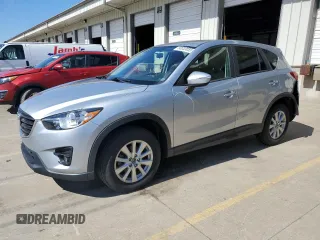 2016 Mazda CX-5 Touring z VIN JM3KE2CY5G0916942, wystawiony jako Copart lot #50033055 z przebiegiem 77 332 mil mil oraz Szkody całkowita. Historia ofert i sprzedaży dostępna na DreamBid. Obrazek 1.
