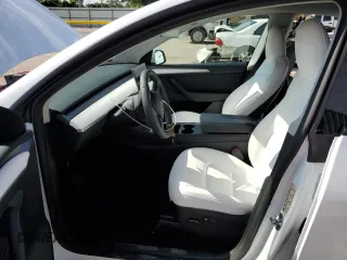 2023 Tesla Model Y Long Range with VIN 7SAYGAEE6PF795434, listed as a Copart auction lot 67507984 with 24,469 mi miles and Salvage Title. Bid and sale history available at DreamBid. Image 7.