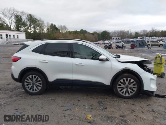 2020 Ford Escape Titanium Hybrid with VIN 1FMCU9DZ0LUC56274, listed as a IAAI auction lot 41256530 with 43,502 mi miles and . Bid and sale history available at DreamBid. Image 14.