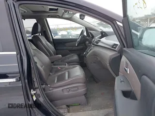 2015 Honda Odyssey EX-L with VIN 5FNRL5H60FB018030, listed as a IAAI auction lot 41608357 with 166,214 mi miles and . Bid and sale history available at carsss.com. Image 5.