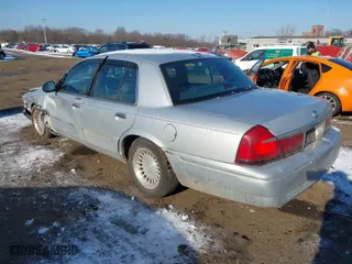 1998 Mercury Grand Marquis LS with VIN 2MEFM75W2WX657976, listed as a IAAI auction lot 41418388 with 102,093 mi miles. Bid and sale history available at carsss.com. Image 3.