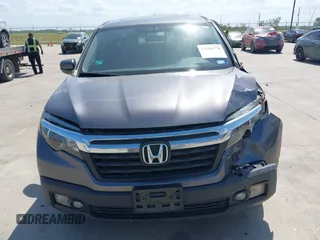 2019 Honda Ridgeline RTL with VIN 5FPYK2F59KB004653, listed as a IAAI auction lot 42066778 with 90,144 mi miles and . Bid and sale history available at DreamBid. Image 12.
