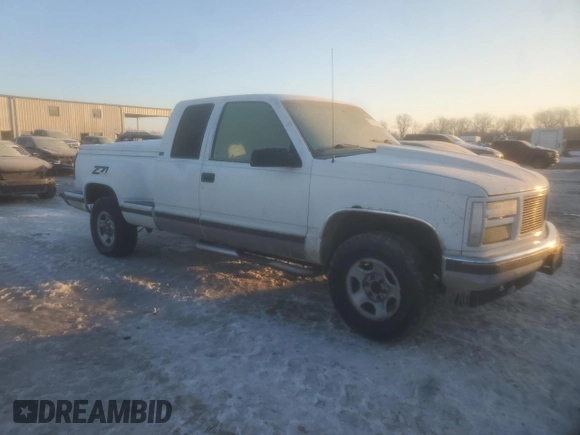 1995 GMC Sierra 1500 z VIN 2GTEK19KXS1504198, wystawiony jako Copart lot #87508215 z przebiegiem 3 210 847 mil mil oraz Szkody całkowita. Historia ofert i sprzedaży dostępna na DreamBid. Obrazek 4.