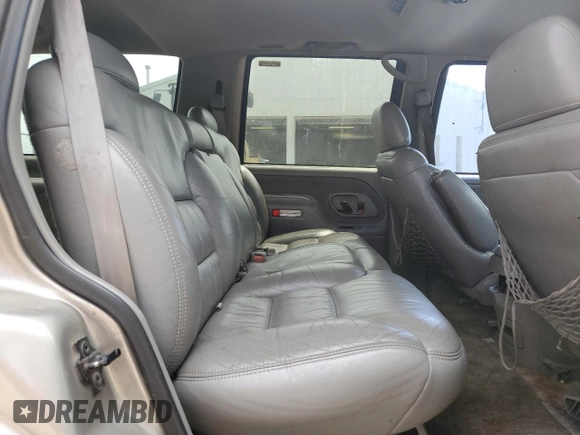 1999 Chevrolet Tahoe Z71 with VIN 1GNEK13R6XJ301562, listed as a Copart auction lot 59684595 with 200,561 mi miles and Salvage title. Bid and sale history available at DreamBid. Image 11.