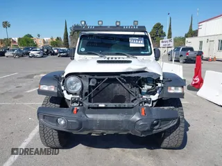 2022 Jeep Gladiator Mojave z VIN 1C6JJTEG0NL103523, wystawiony jako IAAI lot #41842011 z przebiegiem 36 160 mil mil oraz . Historia ofert i sprzedaży dostępna na DreamBid. Obrazek 13.