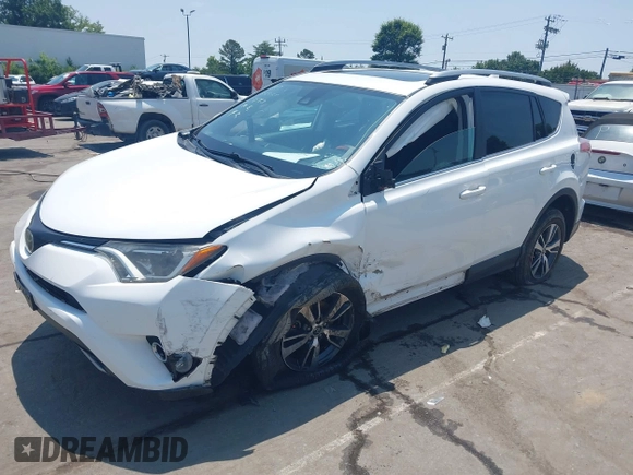 2018 Toyota RAV4 XLE z VIN 2T3WFREV1JW459553, wystawiony jako IAAI lot #42423474 z przebiegiem 129 523 mil mil oraz . Historia ofert i sprzedaży dostępna na DreamBid. Obrazek 6.