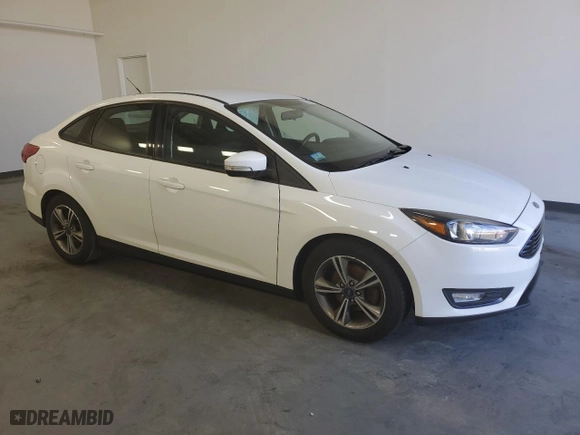 2018 Ford Focus SE with VIN 1FADP3FE4JL219194, listed as a Copart auction lot 48566575 with 136,608 mi miles and Clean Title. Bid and sale history available at carsss.com. Image 4.