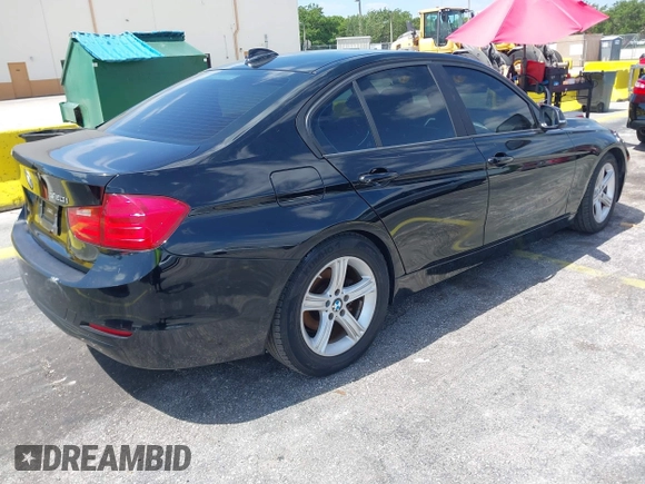 2014 BMW 3 Series 320i with VIN WBA3B1C55EK135357, listed as a IAAI auction lot 42158550 with 148,911 mi miles. Bid and sale history available at carsss.com. Image 4.