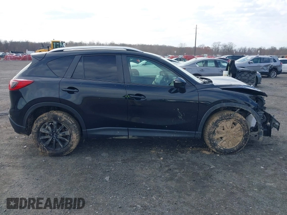2016 Mazda CX-5 Touring with VIN JM3KE4CY7G0602267, listed as a IAAI auction lot 41854213 with 134,170 mi miles and . Bid and sale history available at carsss.com. Image 13.