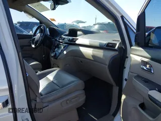 2014 Honda Odyssey Touring with VIN 5FNRL5H97EB037361, listed as a IAAI auction lot 42106742 with 198,279 mi miles and . Bid and sale history available at DreamBid. Image 5.