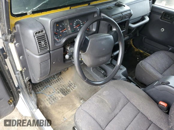 2002 Jeep Wrangler Sport z VIN 1J4FA49S22P763189, wystawiony jako Copart lot #57650295 z przebiegiem 197 383 mil mil oraz Czysty tytuł • Clean title. Historia ofert i sprzedaży dostępna na DreamBid. Obrazek 8.
