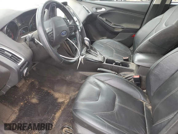 2017 Ford Focus Titanium z VIN 1FADP3N29HL240527, wystawiony jako Copart lot #62891695 z przebiegiem 126 926 mil mil oraz Szkoda całkowita • Salvage title. Historia ofert i sprzedaży dostępna na DreamBid. Obrazek 7.