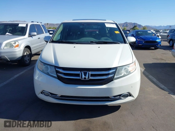 2014 Honda Odyssey Touring with VIN 5FNRL5H97EB037361, listed as a IAAI auction lot 42106742 with 198,279 mi miles and . Bid and sale history available at DreamBid. Image 12.