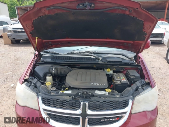 2014 Dodge Grand Caravan SXT with VIN 2C4RDGCG4ER366537, listed as a IAAI auction lot 42148032 with 126,531 mi miles and . Bid and sale history available at DreamBid. Image 10.