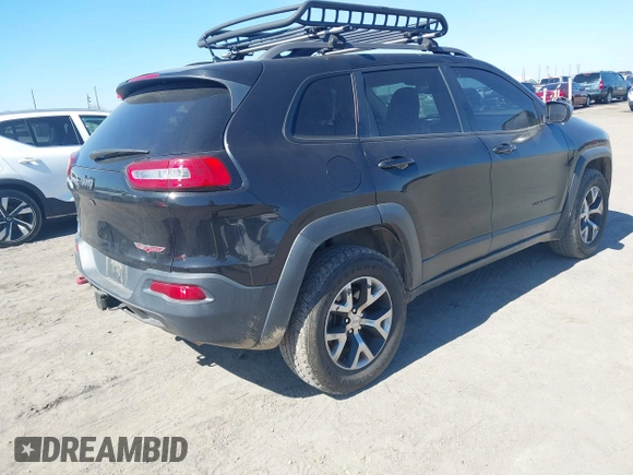 2015 Jeep Cherokee Trailhawk with VIN 1C4PJMBS5FW577470, listed as a IAAI auction lot 41565837 with 191,105 mi miles. Bid and sale history available at carsss.com. Image 4.