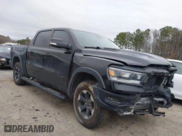 2019 Ram 1500 Rebel z VIN 1C6SRFLT1KN722064, wystawiony jako IAAI lot #41513201 z przebiegiem 113 559 mil mil oraz . Historia ofert i sprzedaży dostępna na DreamBid. Obrazek 1.