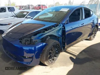 2021 Tesla Model Y Long Range z VIN 5YJYGDEE1MF296454, wystawiony jako IAAI lot #42233096 z przebiegiem 48 125 mil mil oraz . Historia ofert i sprzedaży dostępna na DreamBid. Obrazek 2.