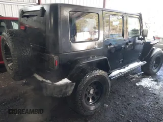 2008 Jeep Wrangler Unlimited Rubicon with VIN 1J8GA69108L562705, listed as a IAAI auction lot 41306923 with 150,002 mi miles and . Bid and sale history available at DreamBid. Image 4.