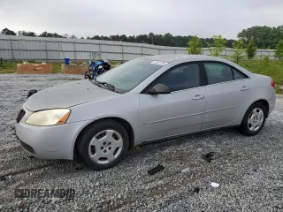 2006 Pontiac G6 1SV with VIN 1G2ZF55B664287900, listed as a Copart auction lot 61601295 with 127,575 mi miles and Salvage title. Bid and sale history available at DreamBid. Image 1.