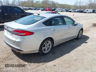 2018 Ford Fusion SE z VIN 3FA6P0H77JR226390, wystawiony jako IAAI lot #42120981 z przebiegiem 114 057 mil mil oraz . Historia ofert i sprzedaży dostępna na DreamBid. Obrazek 4.