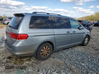 2010 Honda Odyssey EX-L with VIN 5FNRL3H78AB030903, listed as a Copart auction lot 52911705 with 200,499 mi miles and Salvage Title. Bid and sale history available at carsss.com. Image 3.