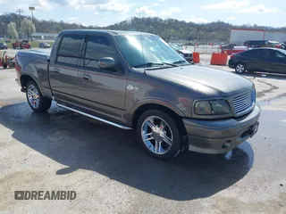 2002 Ford F-150 Harley Davidson with VIN 1FTRW07392KE11409, listed as a IAAI auction lot 41877998 with 148,476 mi miles. Bid and sale history available at carsss.com. Image 1.