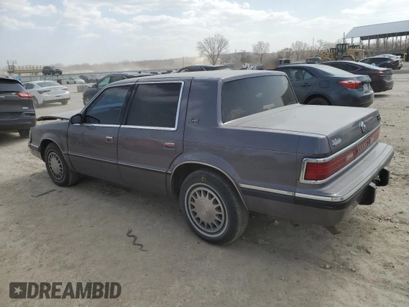 1993 Dodge Dynasty z VIN 1B3XC4638PD195963, wystawiony jako Copart lot #49120625 z przebiegiem 86 825 mil mil oraz Szkoda całkowita • Salvage title. Historia ofert i sprzedaży dostępna na DreamBid. Obrazek 2.