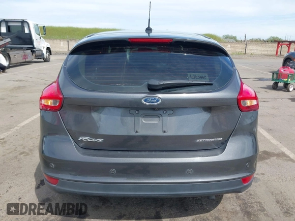 2018 Ford Focus Titanium with VIN 1FADP3N23JL241453, listed as a IAAI auction lot 42025190 with 90,174 mi miles and . Bid and sale history available at DreamBid. Image 16.