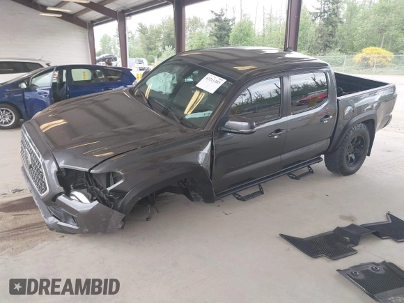 2019 Toyota Tacoma SR z VIN 3TMCZ5AN1KM257081, wystawiony jako IAAI lot #42211385 z przebiegiem 60 229 mil mil oraz . Historia ofert i sprzedaży dostępna na DreamBid. Obrazek 2.