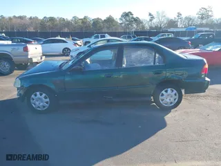 1999 Honda Civic VP with VIN 2HGEJ6614XH564053, listed as a IAAI auction lot 41317610 with 241,757 mi miles. Bid and sale history available at carsss.com. Image 15.