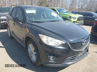 2014 Mazda CX-5 Grand Touring with VIN JM3KE4DY1E0339690, listed as a IAAI auction lot 41668780 with 216,825 mi miles. Bid and sale history available at carsss.com. Image 1.