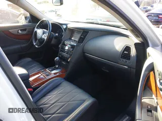 2014 Infiniti QX70 with VIN JN8CS1MW2EM411237, listed as a IAAI auction lot 42011806 with 148,133 mi miles and . Bid and sale history available at carsss.com. Image 5.